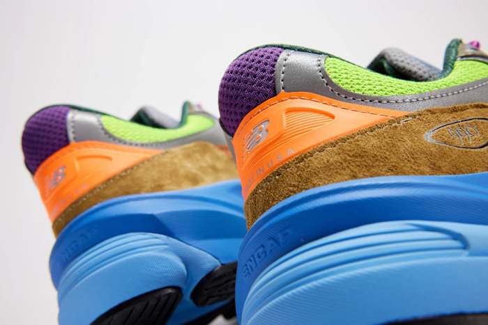 View of brown, blue, and green New Balance shoes.